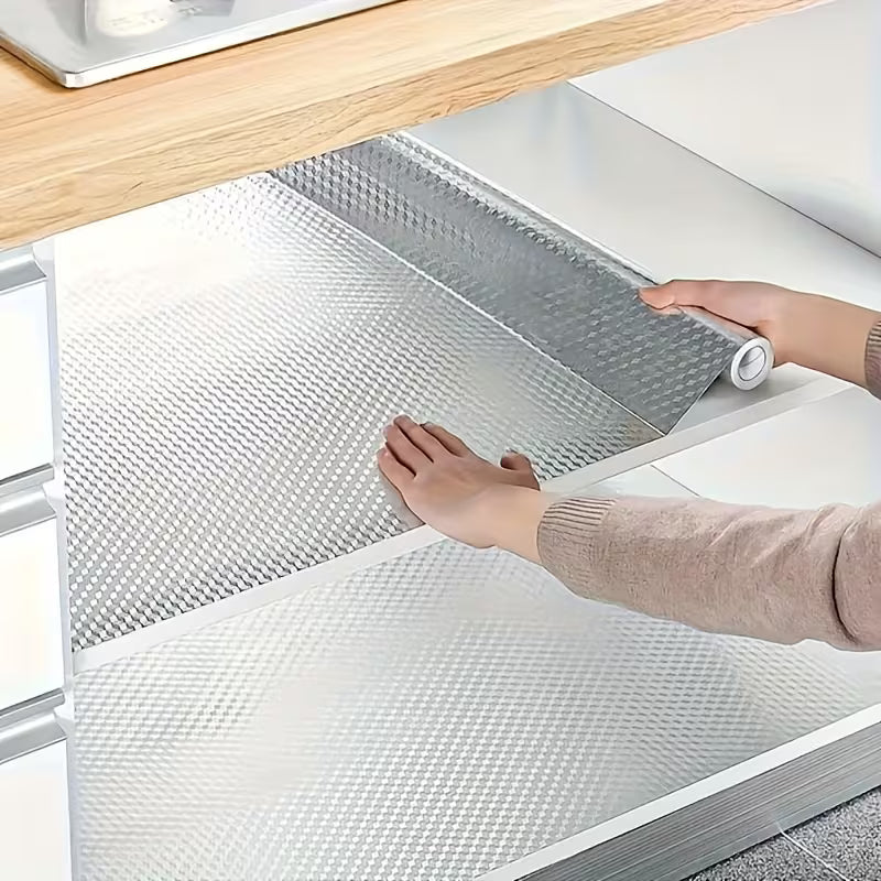 Person applying a Self Adhesive Kitchen Wall Paper to a kitchen cabinet.