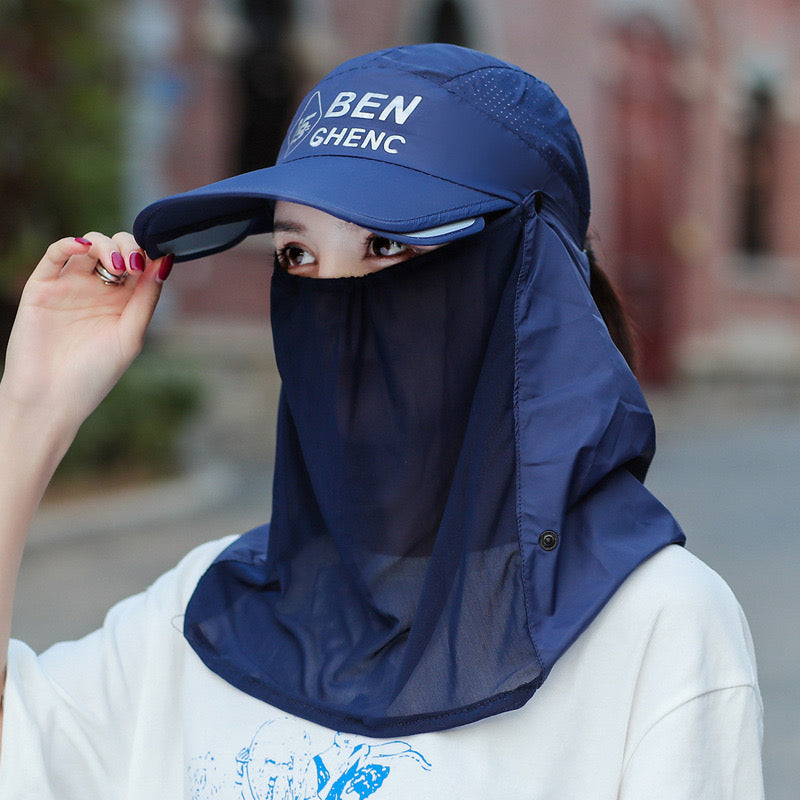 A Woman is Wearing Wide Brim Bucket Hat with Neck Cover.
