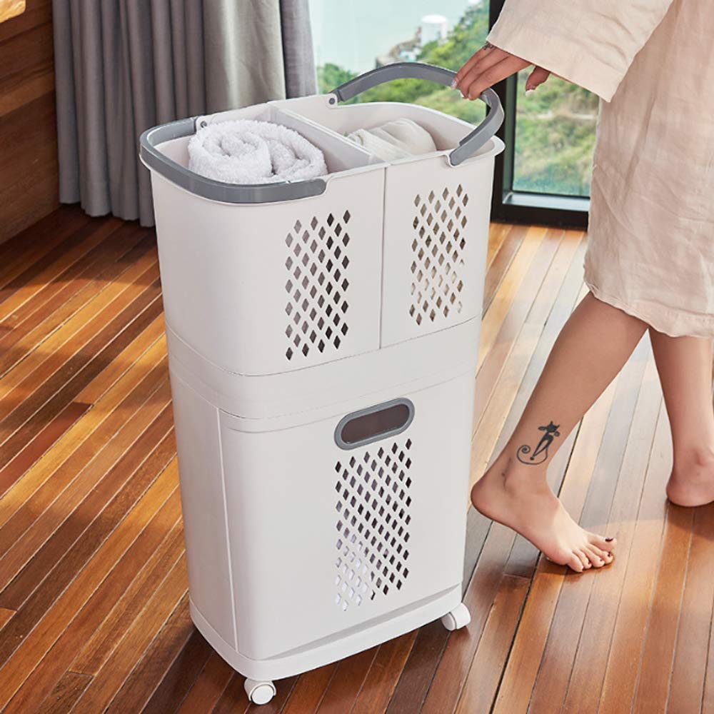 A person holds the handle of a laundry basket and makes it move.