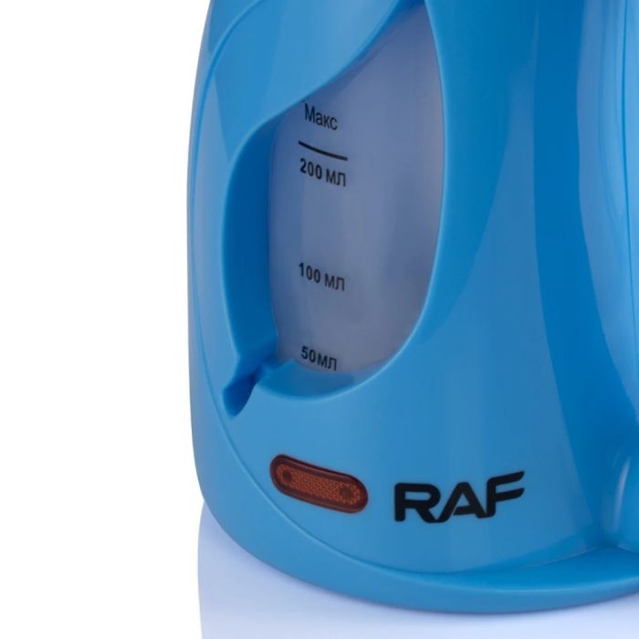 A RAF Mini Steam Iron.