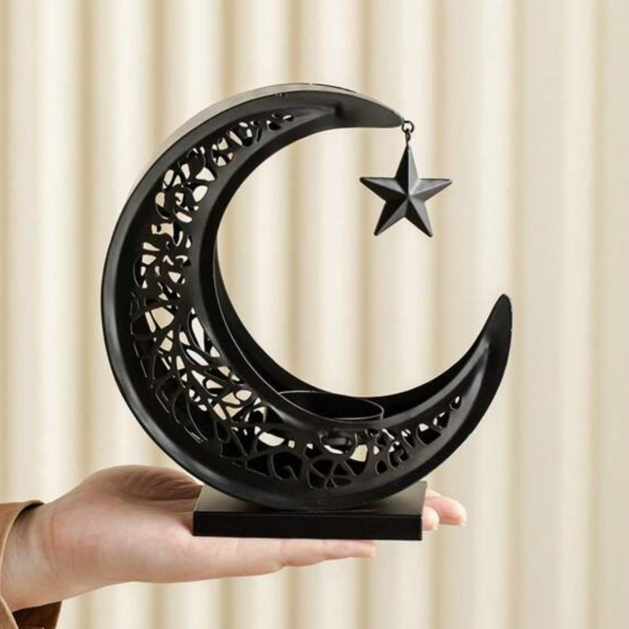 A Person is Holding Ramadan Eid Moon Shaped Bhukoor Burner.