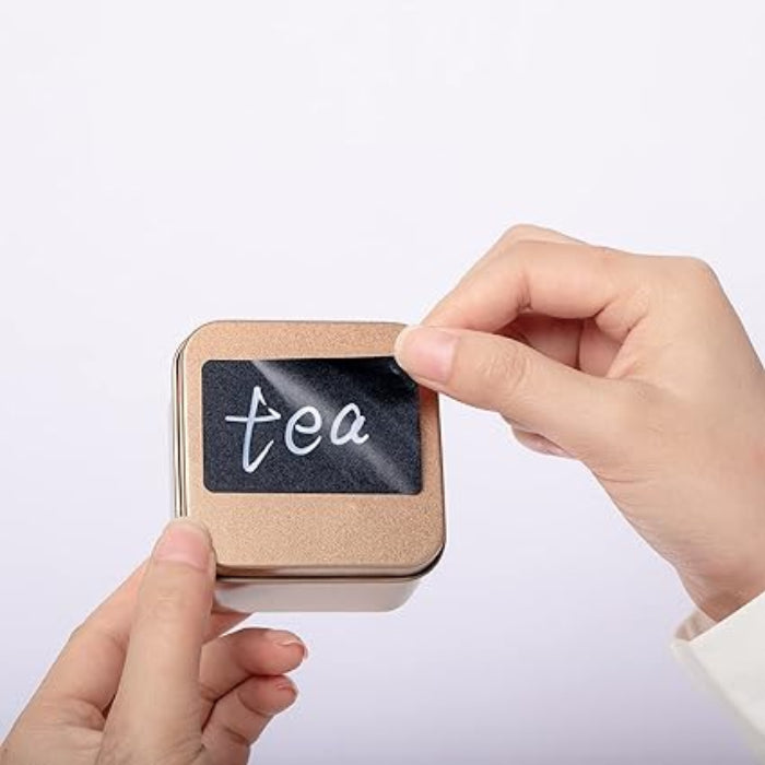 Somebody is trying to install Reusable Black Chalkboard Labels Roll on the box