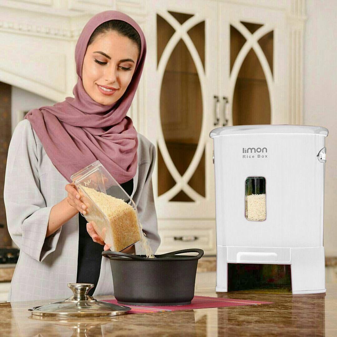 A Woman is Taking Rice From Rice Box with Measuring.