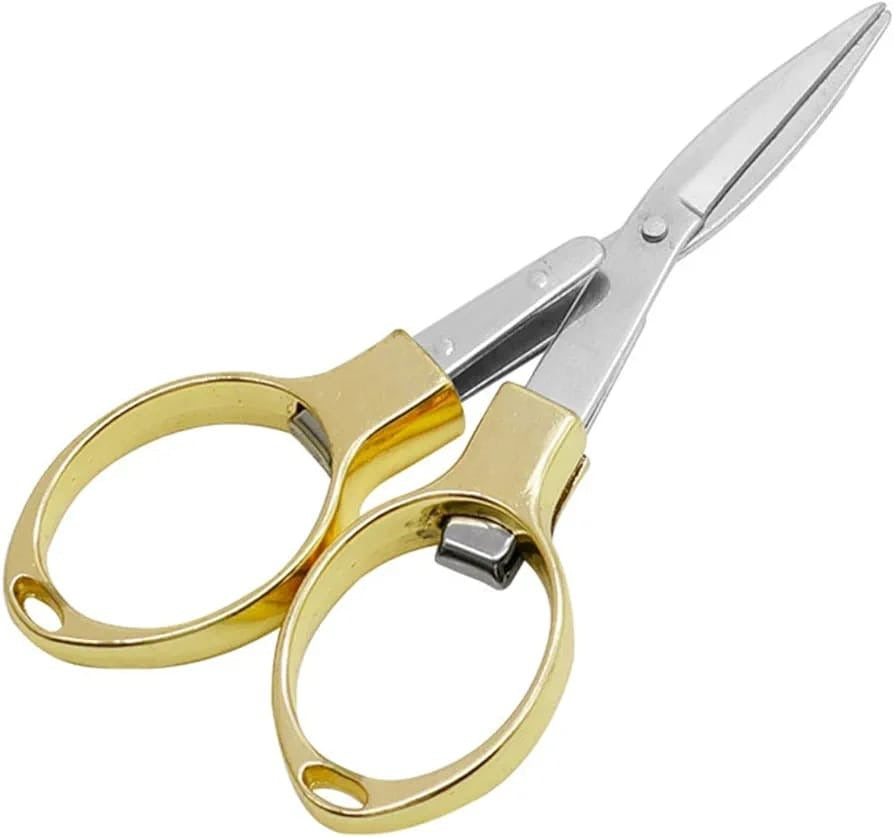 Folding Pocket Scissors in White Background.