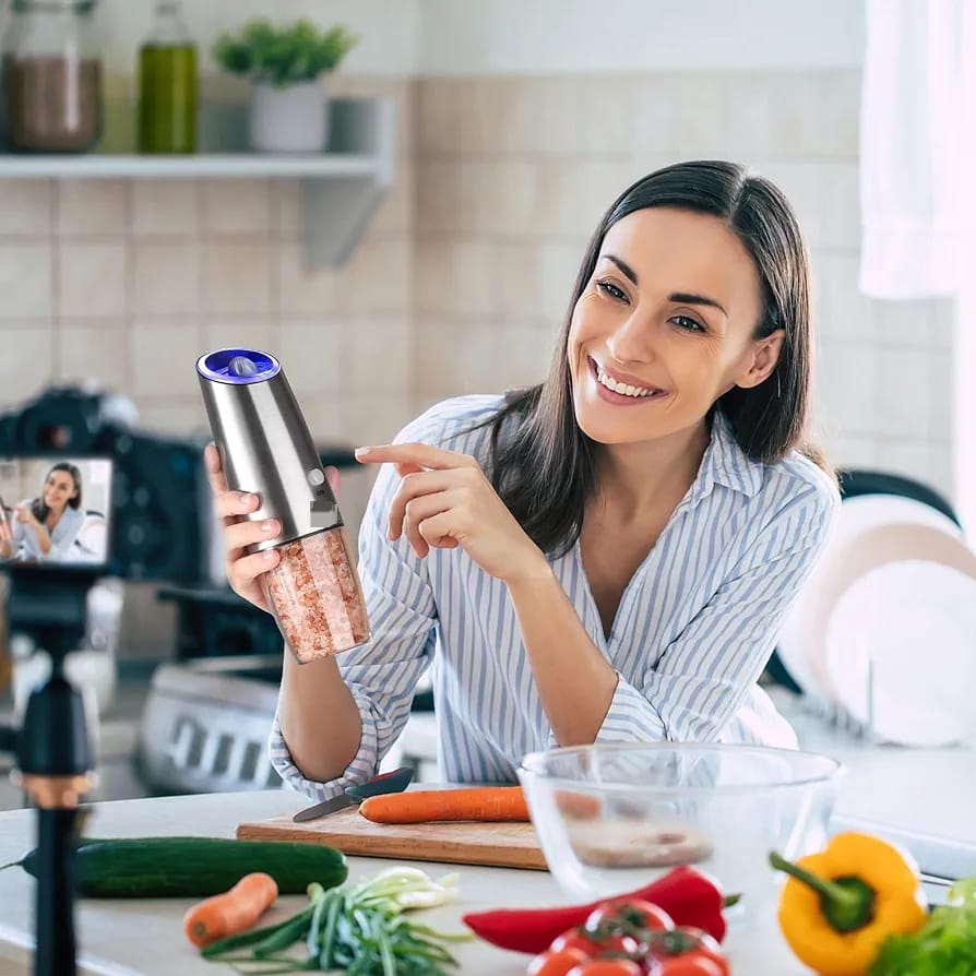 A Women with USB Rechargeable Spice Grinder.
