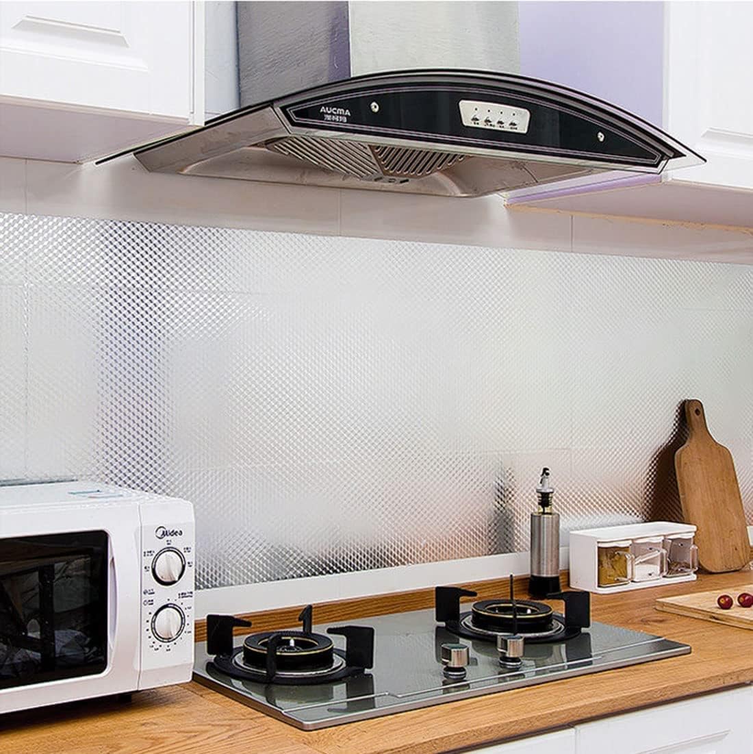 Modern kitchen with Self Adhesive Wallpaper at the Kitchen with gas stove, microwave, and decorative elements.