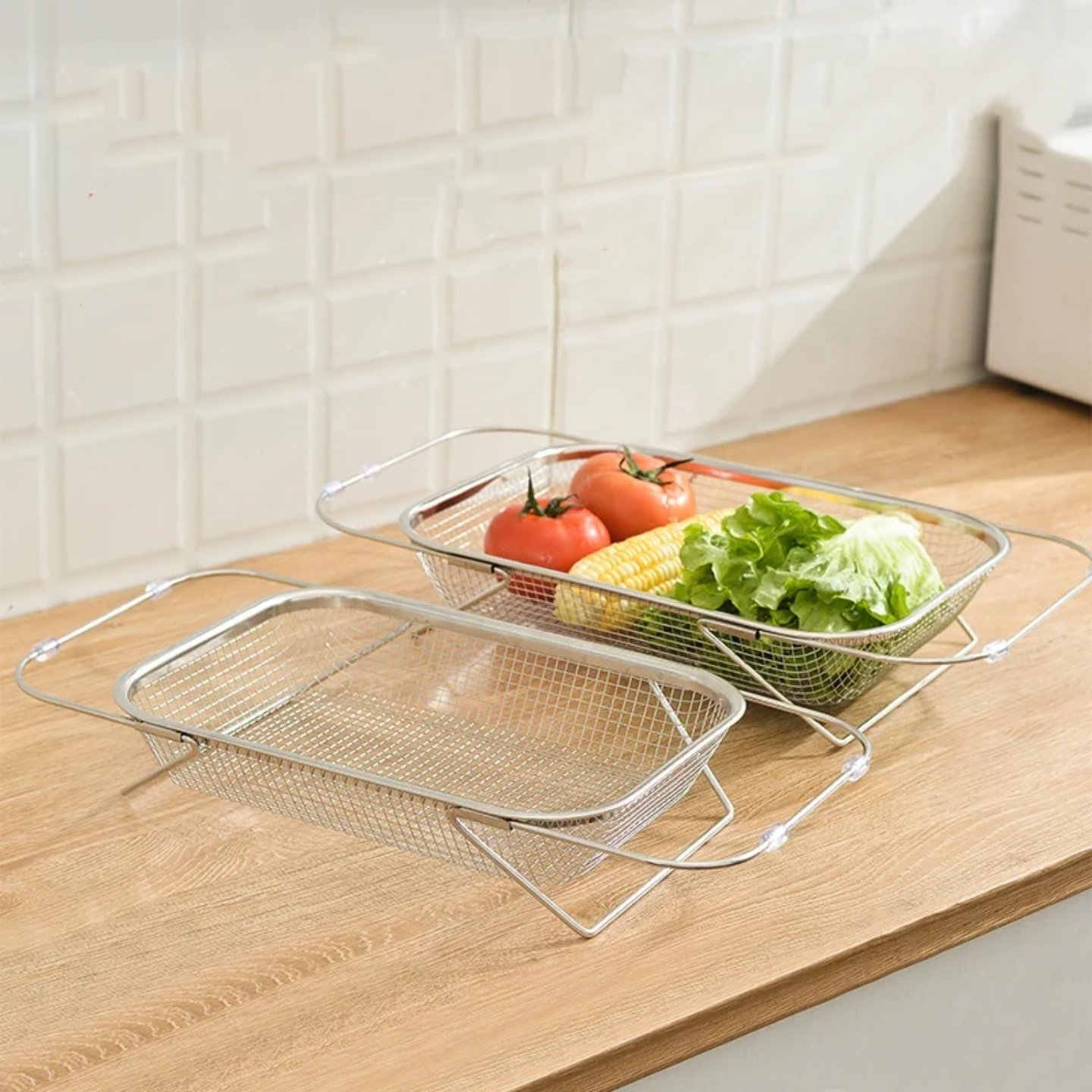 A Sink Drain Basket Colander with Vegetables are Placed Above Kitchen Cabinet.