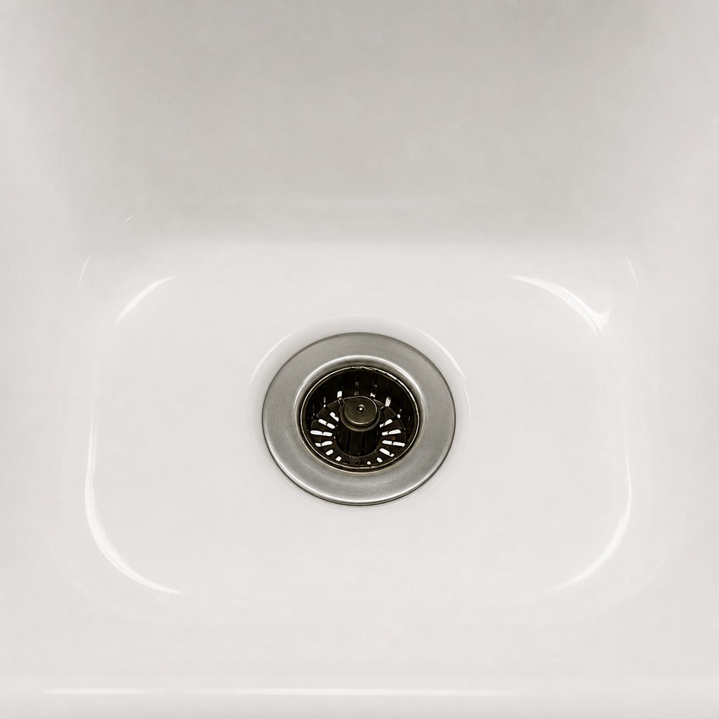 Close-up of a white kitchen sink with a Sink Drain Strainer