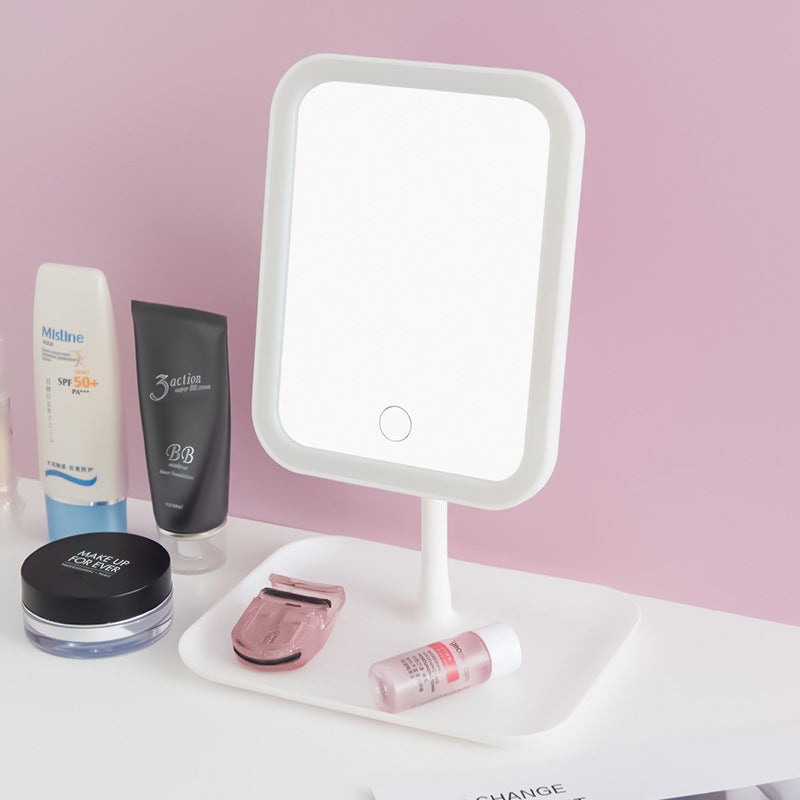 Smart LED Makeup Mirror is Placed Along with Cosmetics Items.