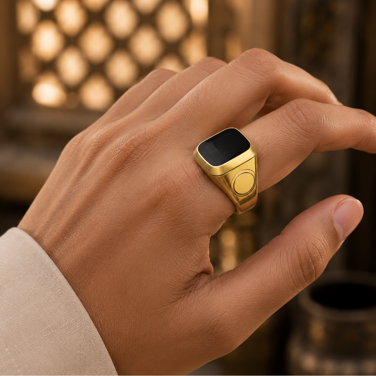 Smart Tasbih Ring Counter worn on a finger against a warm, blurred background