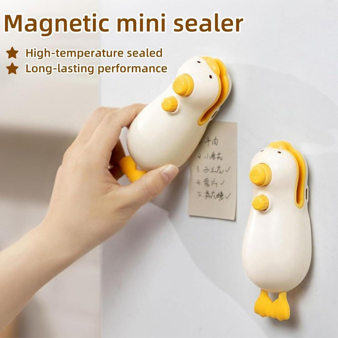 A Person is Placing Snack Bag Sealer Machine on Referigerator Door.