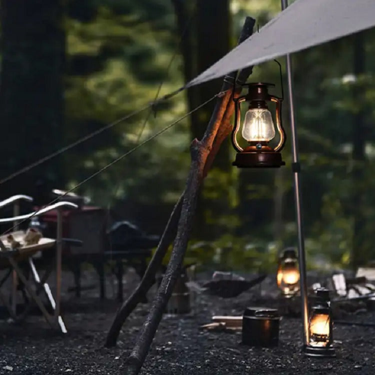 Camp setup in the forest with hanging Lantern lights