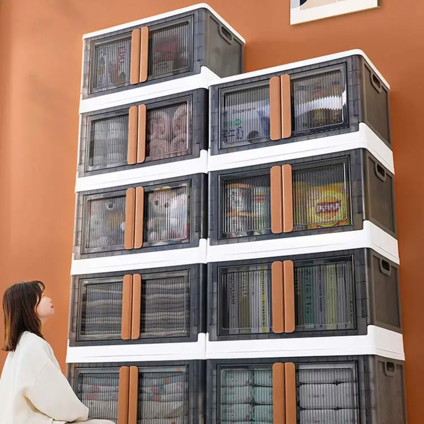 A Woman is Standing Infront Of Stackable Storage Bins.