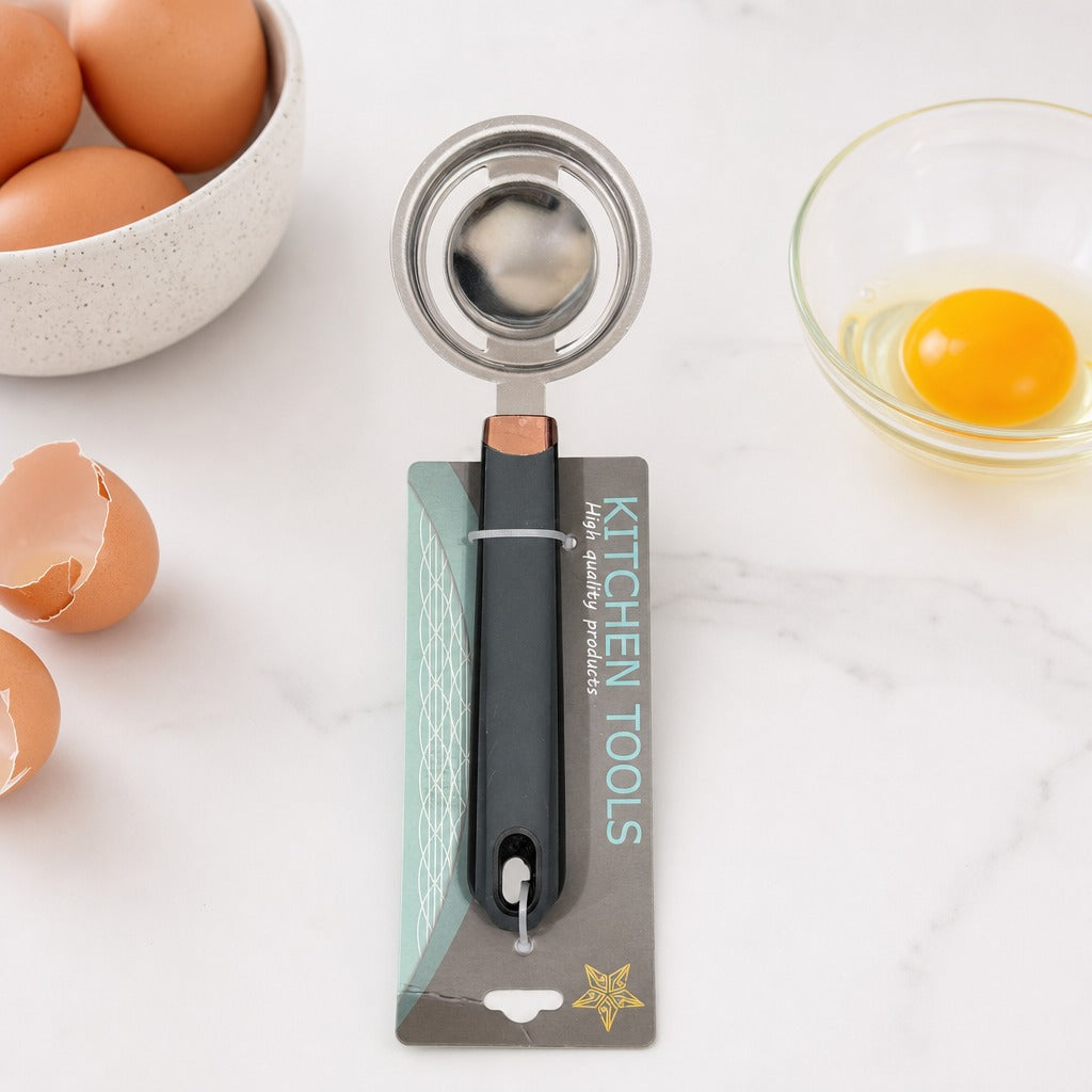 Stainless Steel Egg Yolk Separator is Placed on a Kitchen Countertop along with a Bowl of Eggs.