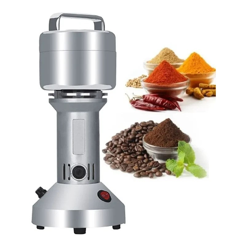 A Stainless Steel Powder Grinder Placed Along with Grinded Spices.