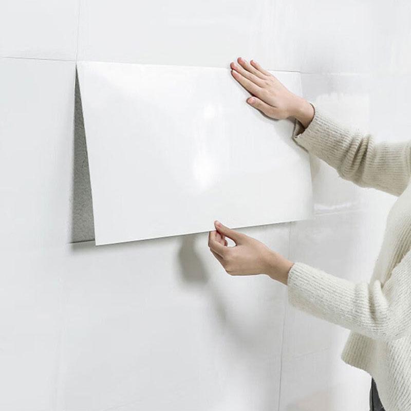 A Girl is Sticking 3D Imitation Marble Pattern Wall Sticker.