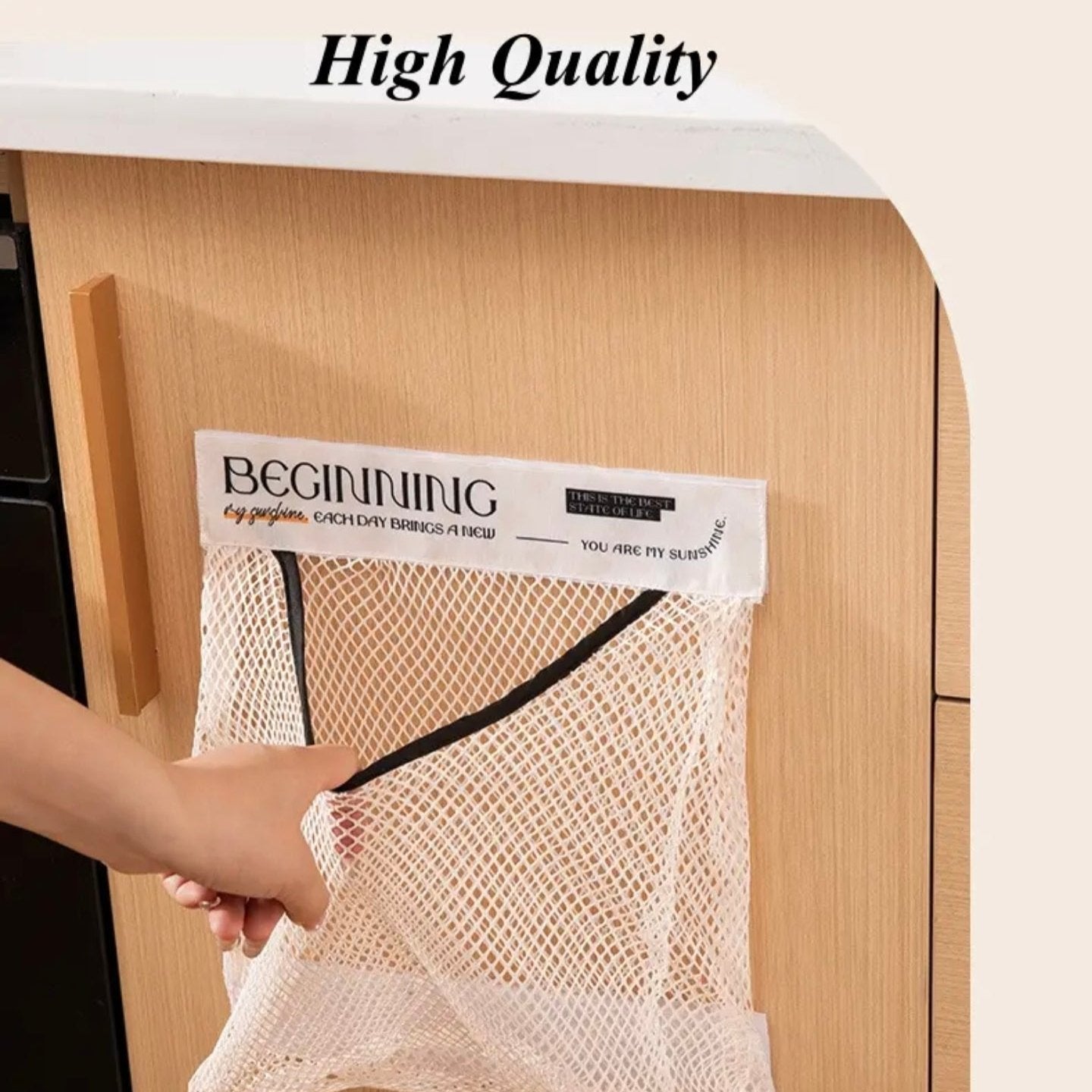 A Person is Keeping Plastic Bags in a Sticky Wall Mounted Storage Organizer Bag.