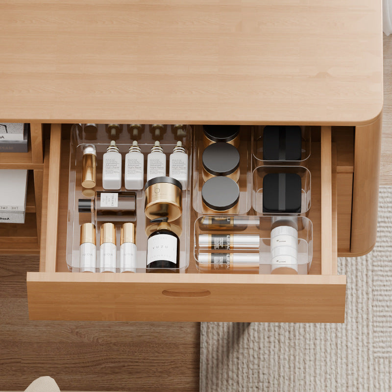 A Storage Organizer Tray in a Drawer is Organized with Cosmetic Items.