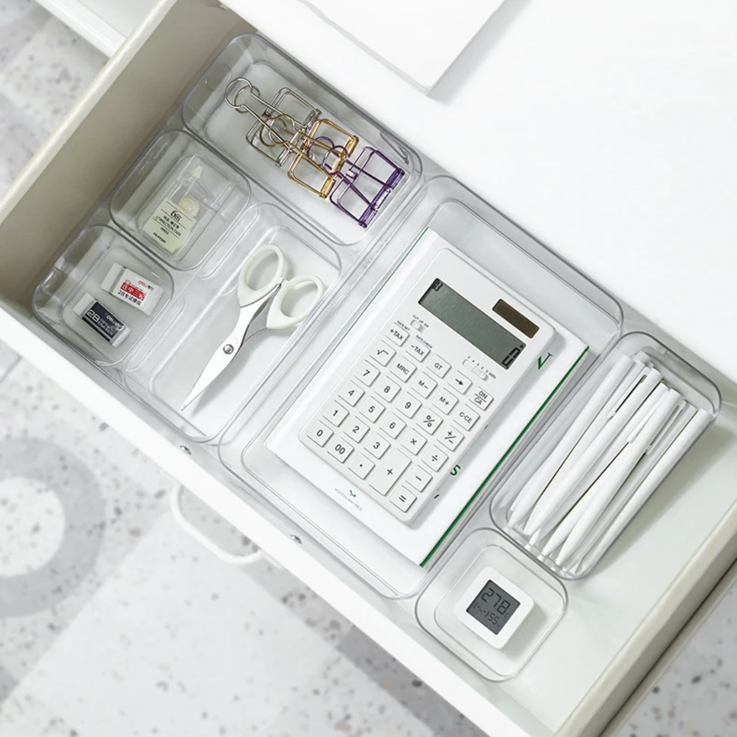 A Storage Organizer Tray is Organized with Office Essentials.