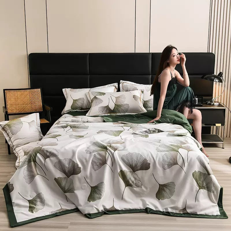 A Woman is Resting on Summer Cooling Comforter Set.