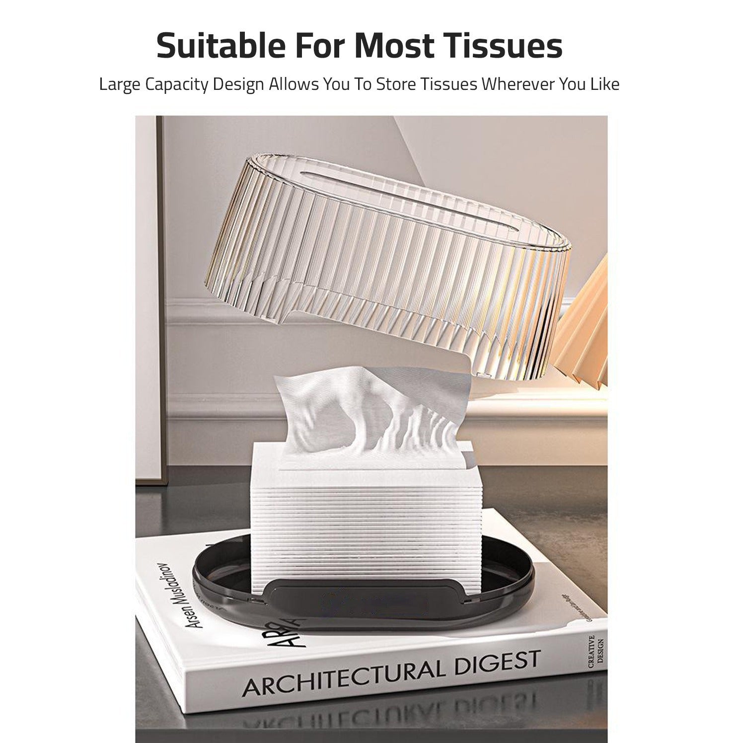 Transparent tissue holder designed to fit most types of tissues. The product is placed on top of a white book