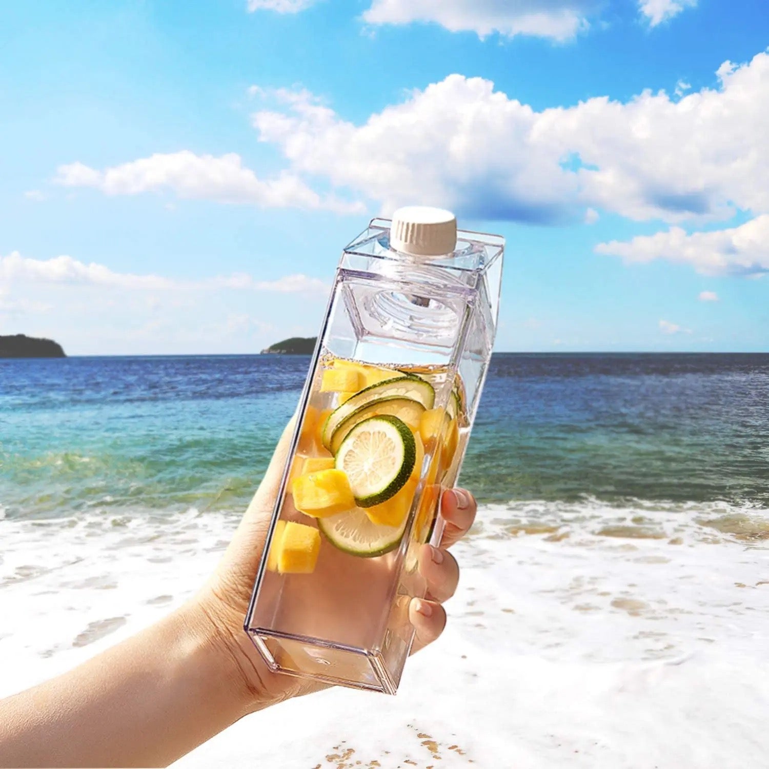 A Person is Holding Transparent Plastic Juice Bottle With Juice.