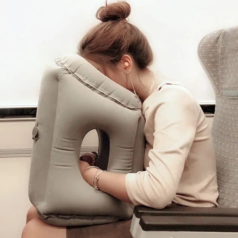 A woman is Sleeping with the aid of Travel Neck Pillow.