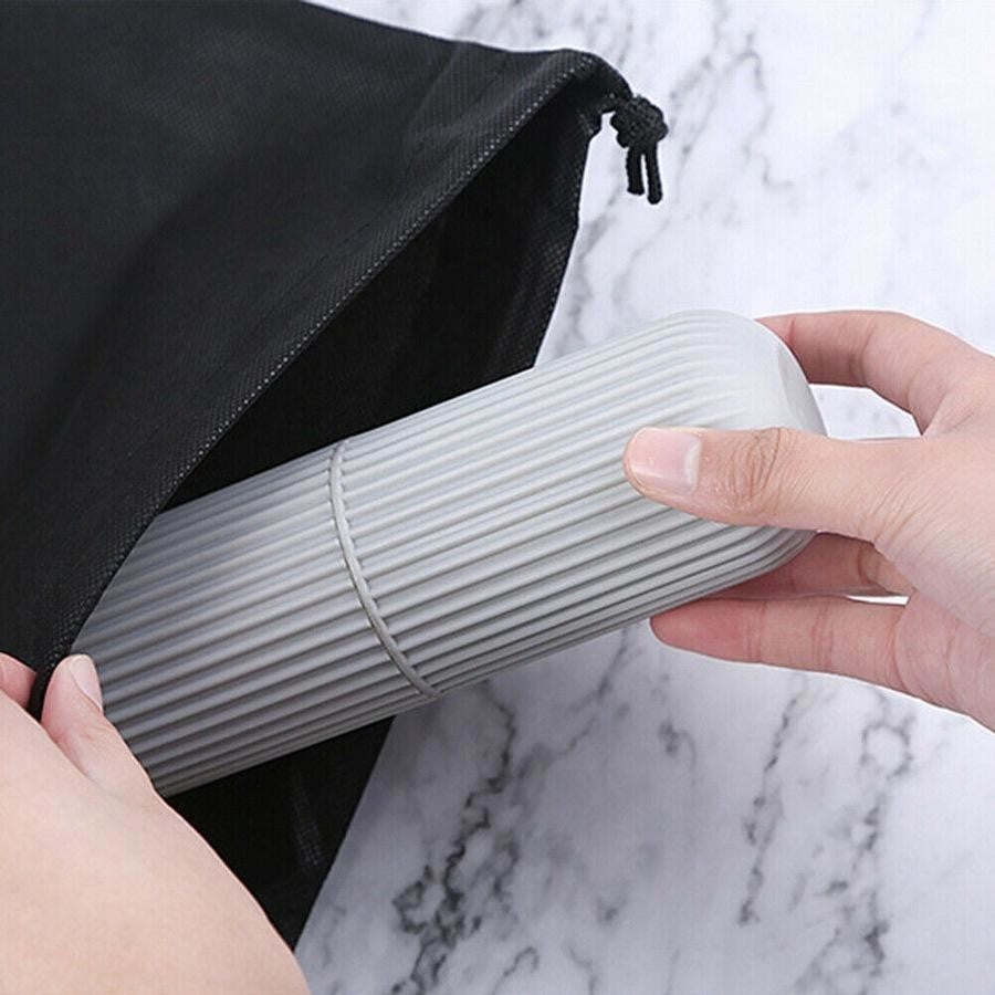 A Person is Keeping Travel Toothbrush Holder Case in to her bag.