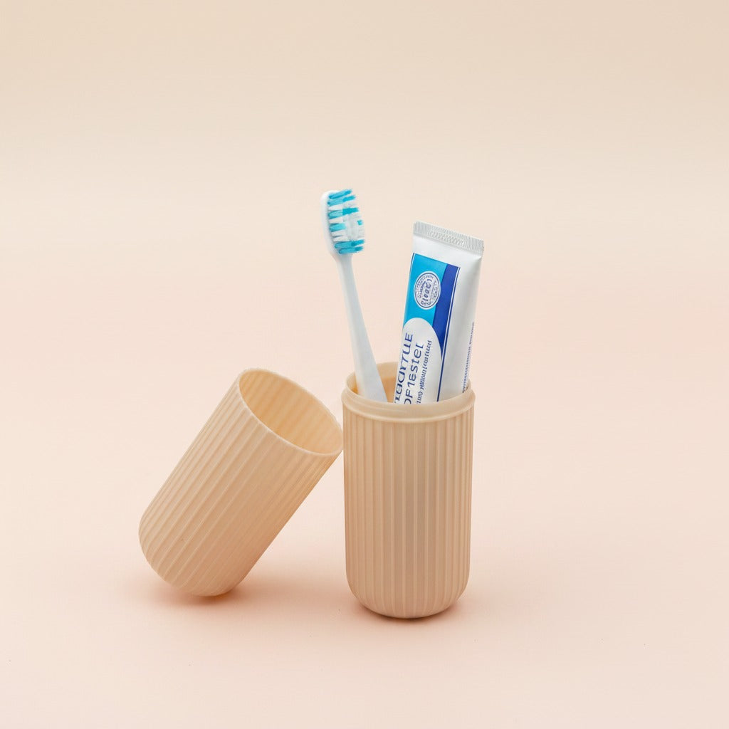 Travel Toothbrush Holder Case with a toothbrush and tube of toothpaste on a beige background