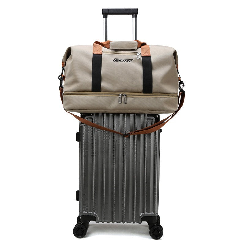 Multi-functional Fashion Fitness Travel Duffle Bag is Placed Above Trolley Bag.