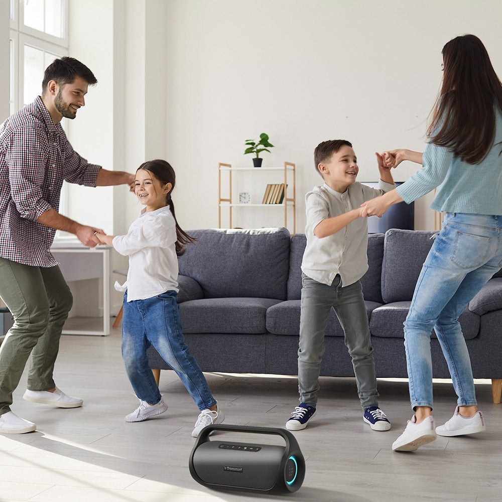 A Family is Enjoying By Playing Tronsmart Bang Mini Portable Party Speaker.