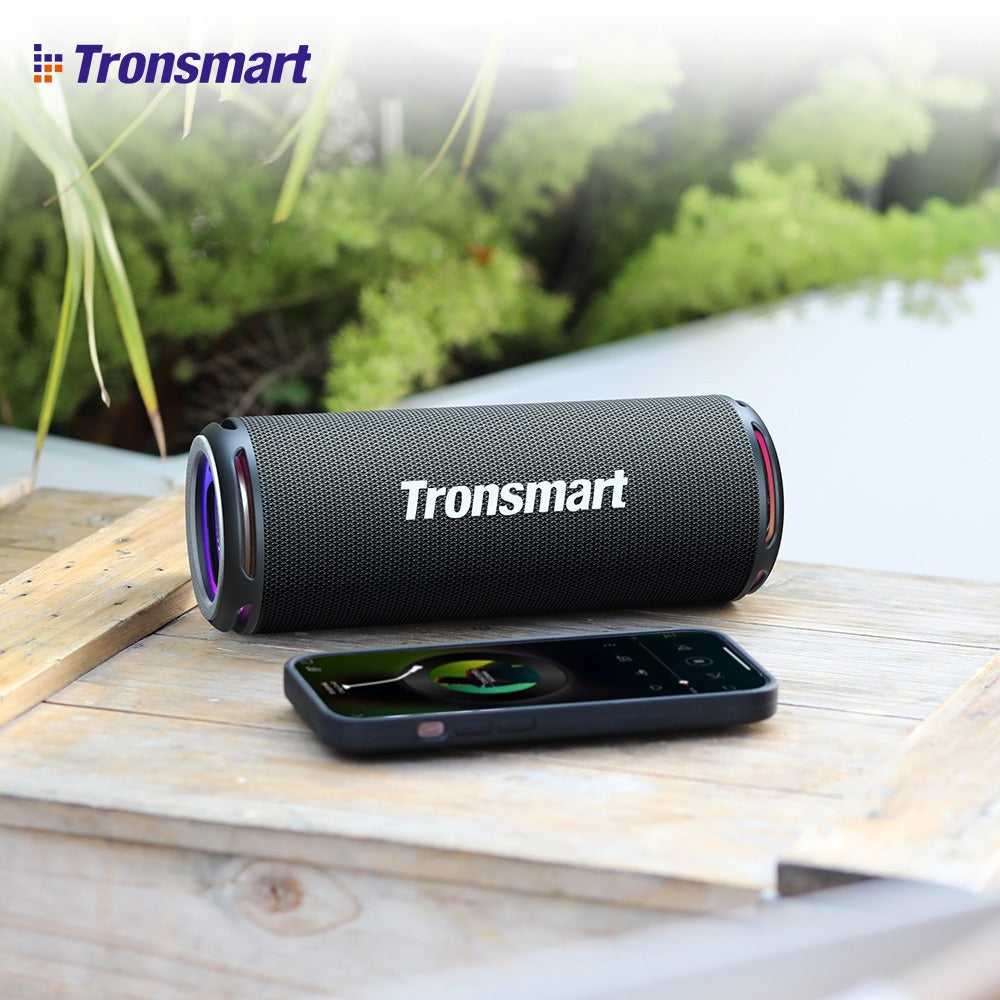 Tronsmart T7 Lite Portable Outdoor Speaker Placed Along With Mobile Phone.