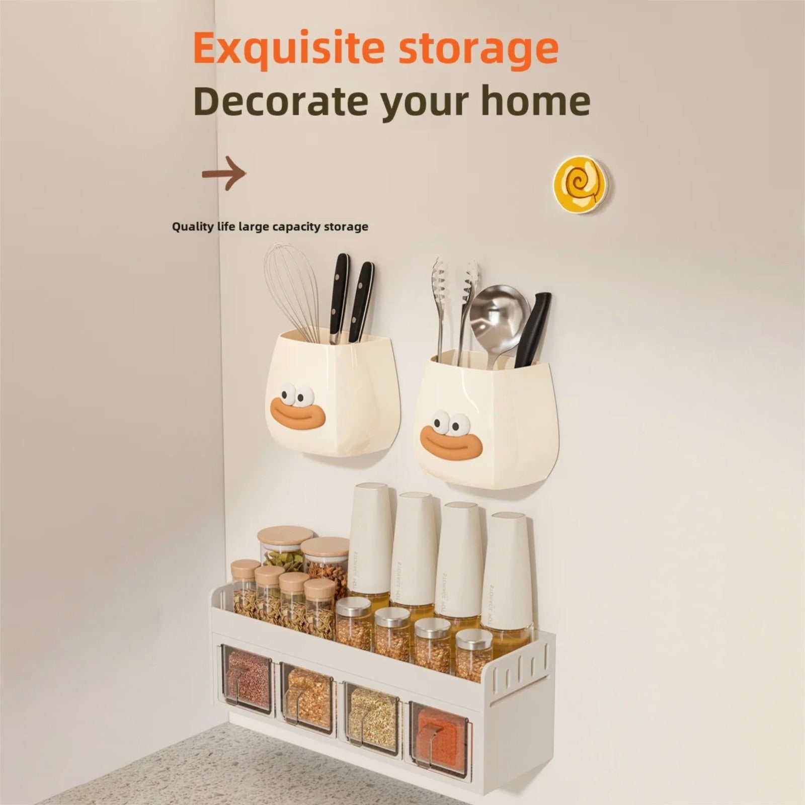Two cute cartoon-style wall-mounted organizers with smiling faces, used to store kitchen tools.