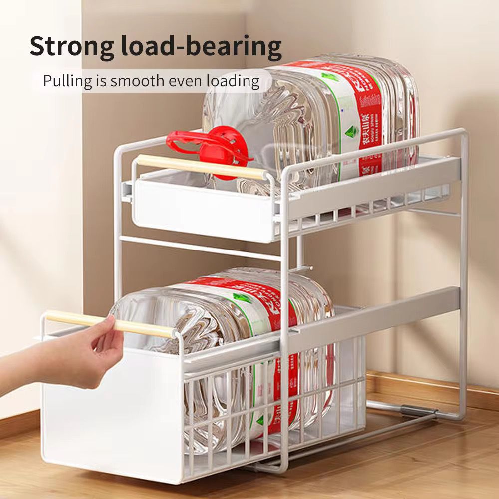 A Person is Sliding Under Sink Storage Rack.