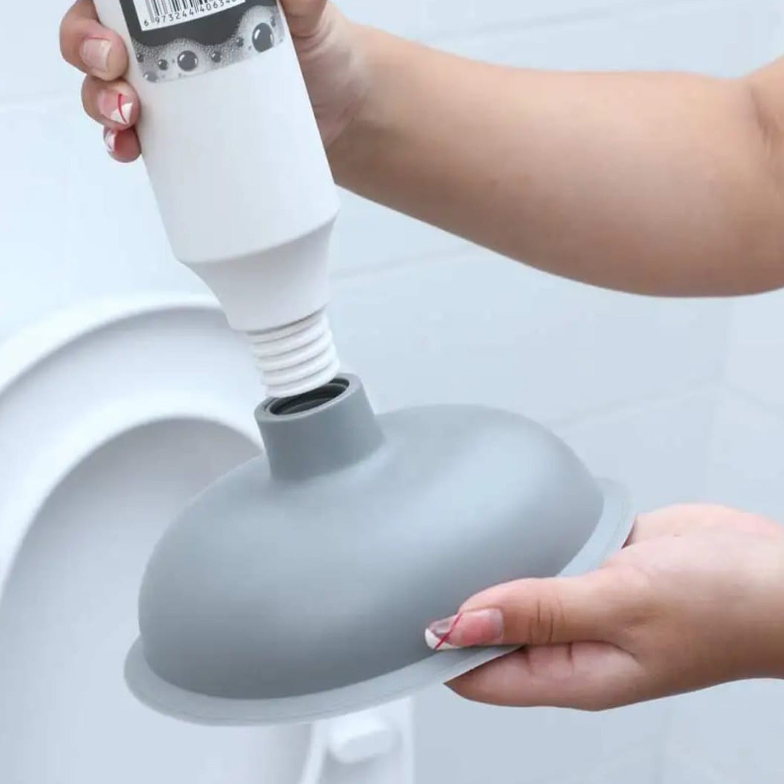 A Person is Holding a Vacuum Type Multi-Purpose Pipeline Unclogger.