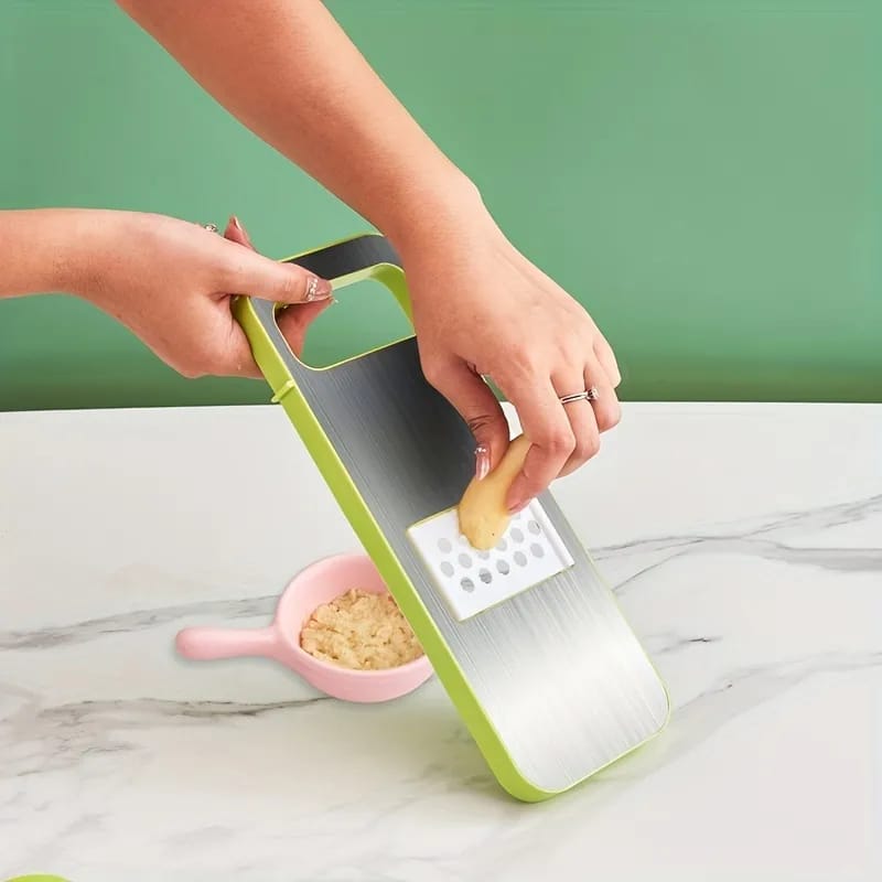 A slicer slicing vegetable.