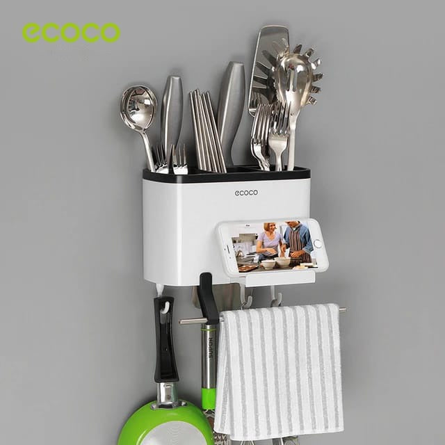 Ecoco Utensil Storage Rack placed on the wall with some items in it