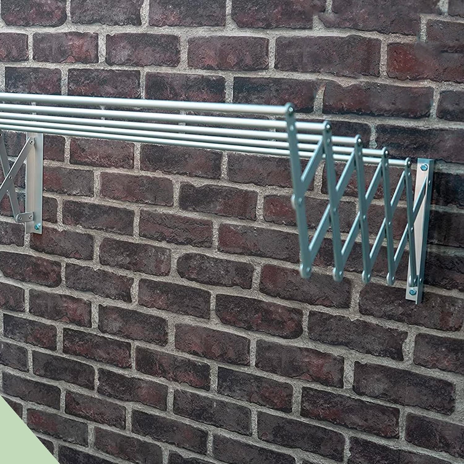 Wall-mounted 5-bar extendable clothes hanger on the wall