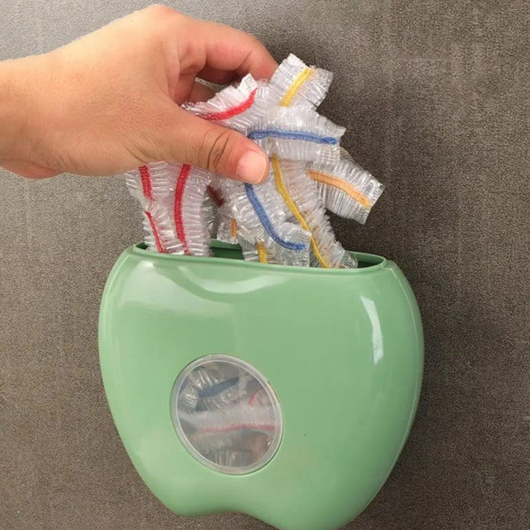 A Person is Filling Cling Bags in to Wall Mounted Plastic Wrap Storage Box.