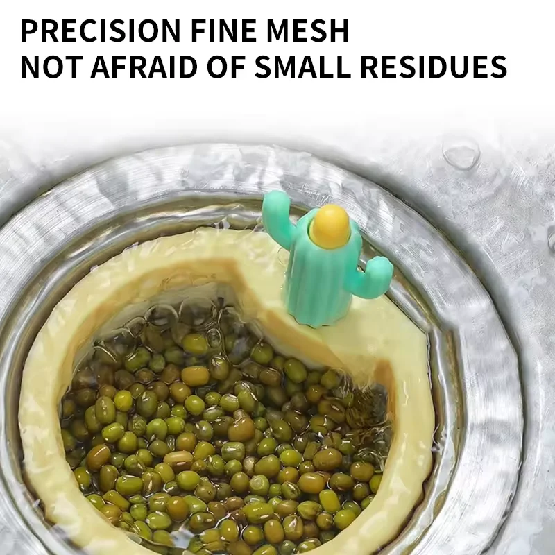 A Cute Kitchen Sink Drainer is Placed In a Sink and Having Waste Particles.
