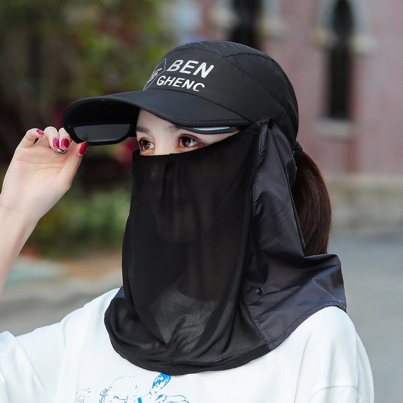 A Woman is Wearing Wide Brim Bucket Hat with Neck Cover.