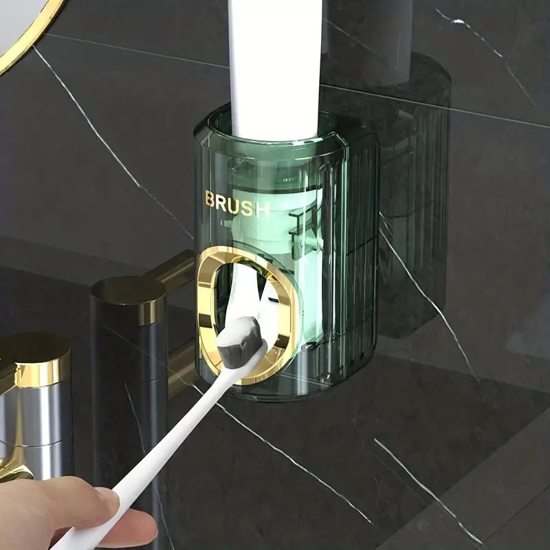 A person extracting toothpaste from Wall-Mounted Toothpaste Dispenser and Squeezer