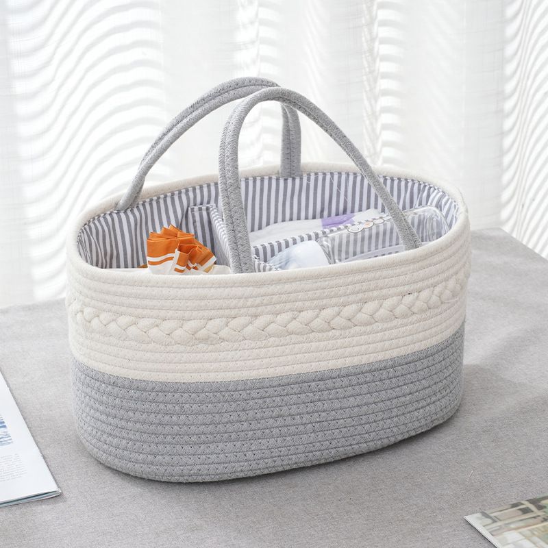 Grey color Nursery Storage Basket kept on top of a table