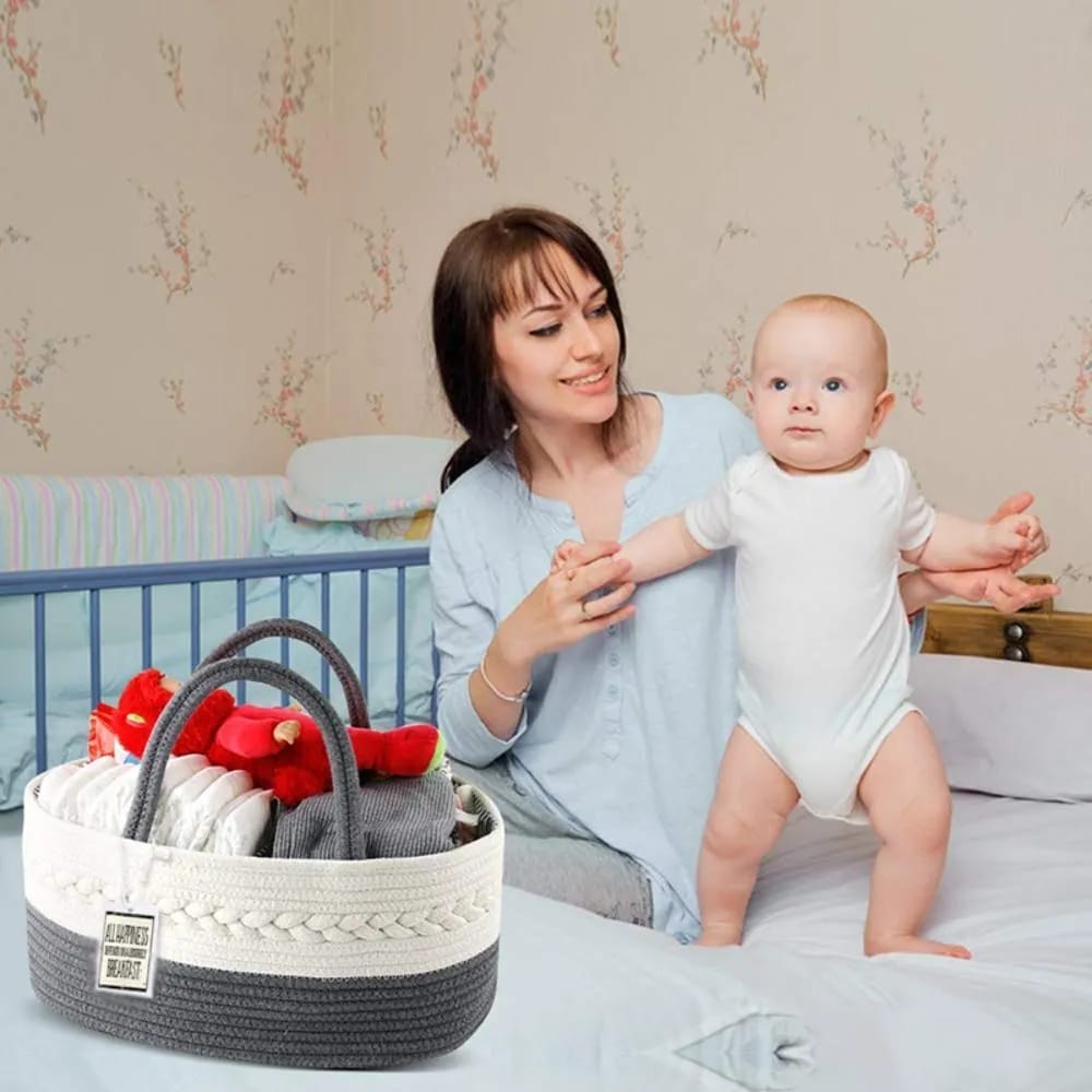 Neatly organized Nursery Storage Basket kept in front of a mother and baby on bed