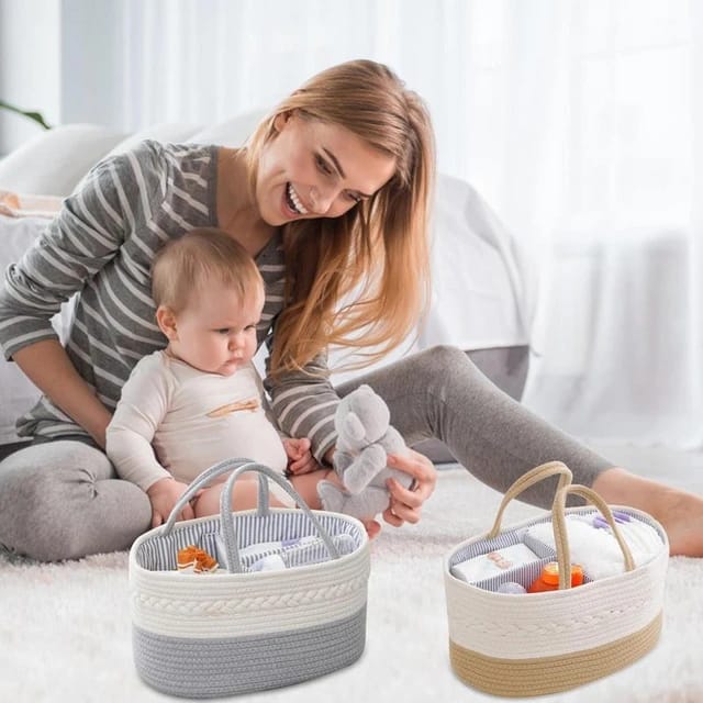 2 Nursery Storage Baskets placed near to a mother and a baby on bed