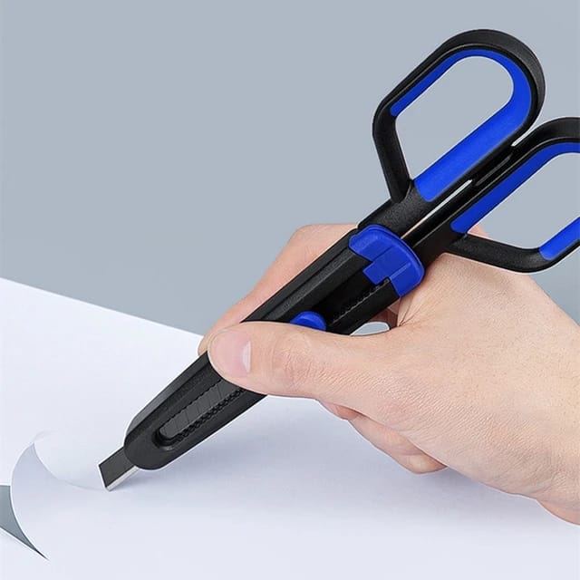 A paper being teared by a person with Scissors using it's Paper Cutting Blade