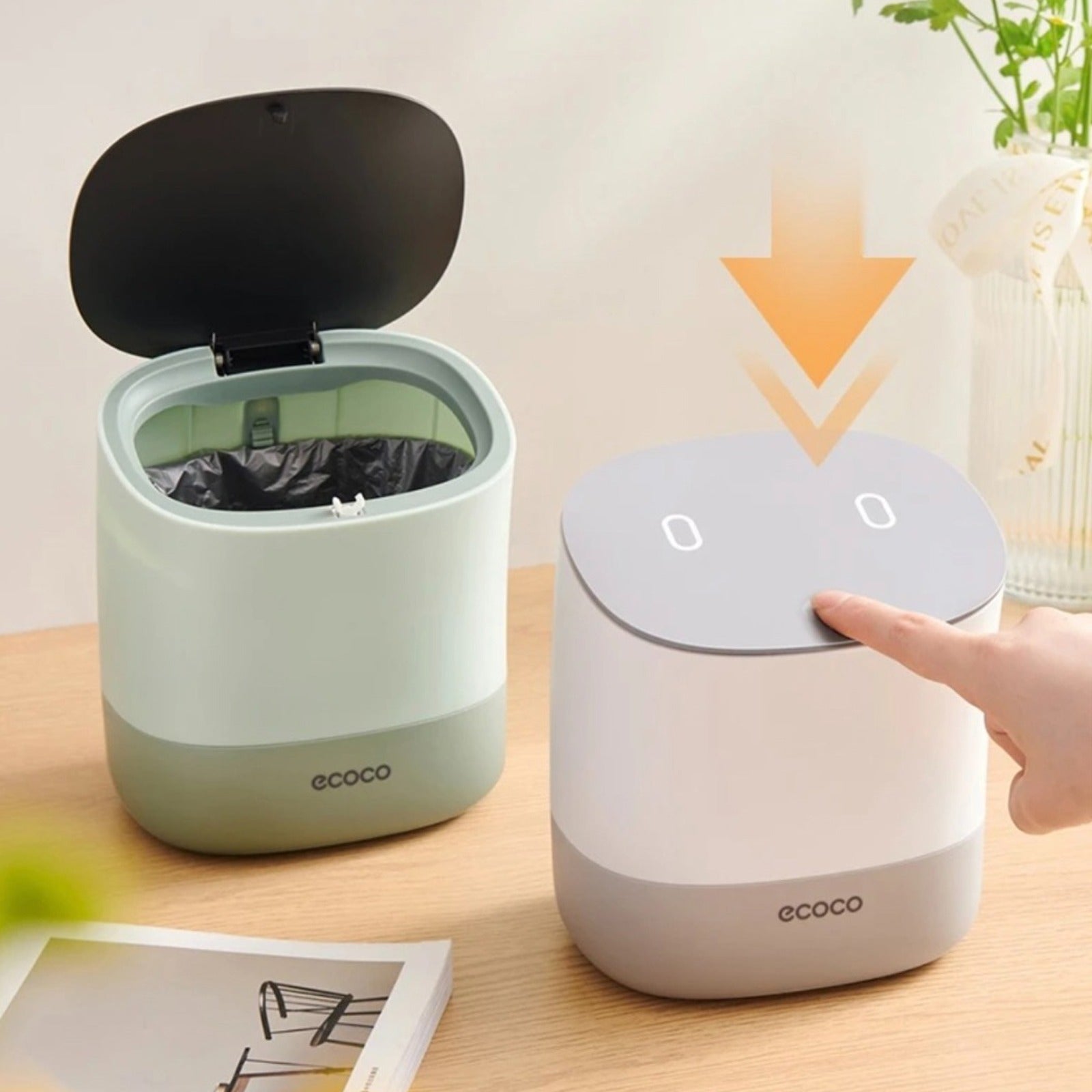 A person pressing on the lid of Mini Desktop Waste Bin to open it