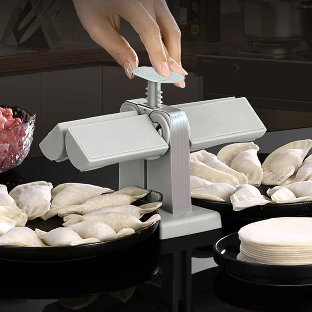 Someone making dumplings with the help of Double Head Semi Automatic Dumpling Maker Mould