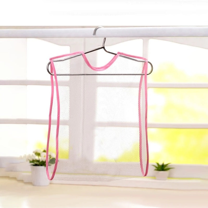 Empty Toy and Pillow Drying Net hung on a white color rod next to a window