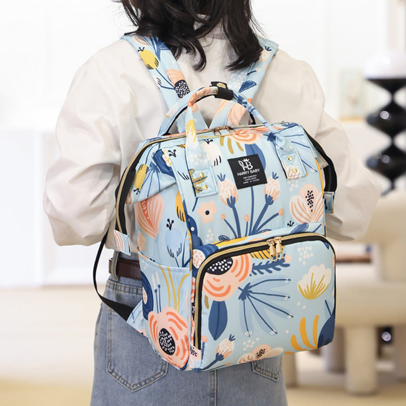 A woman carrying Mother Backpack Bag